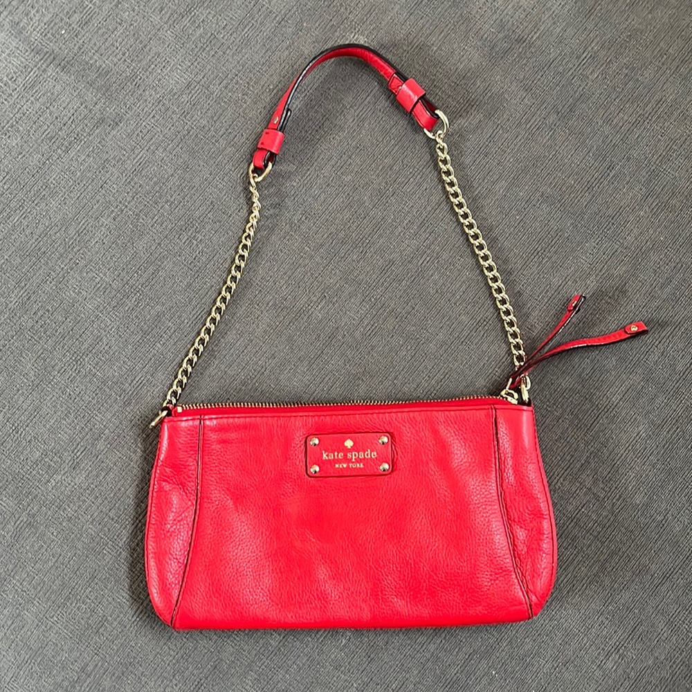 Coral Kate Spade leather shoulder clutch with gold hardware
